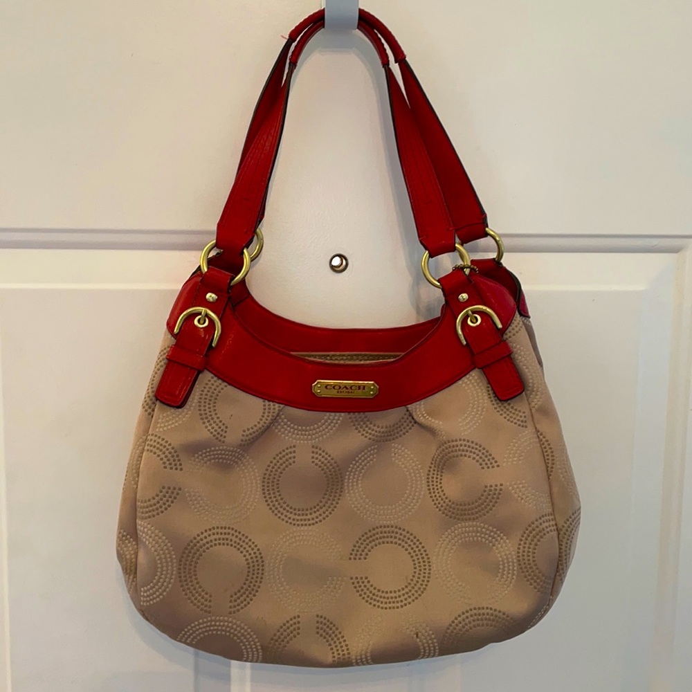 Medium sized Coach purse with red trim